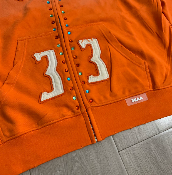 DUAA Orange Studded Varsity Hoodie